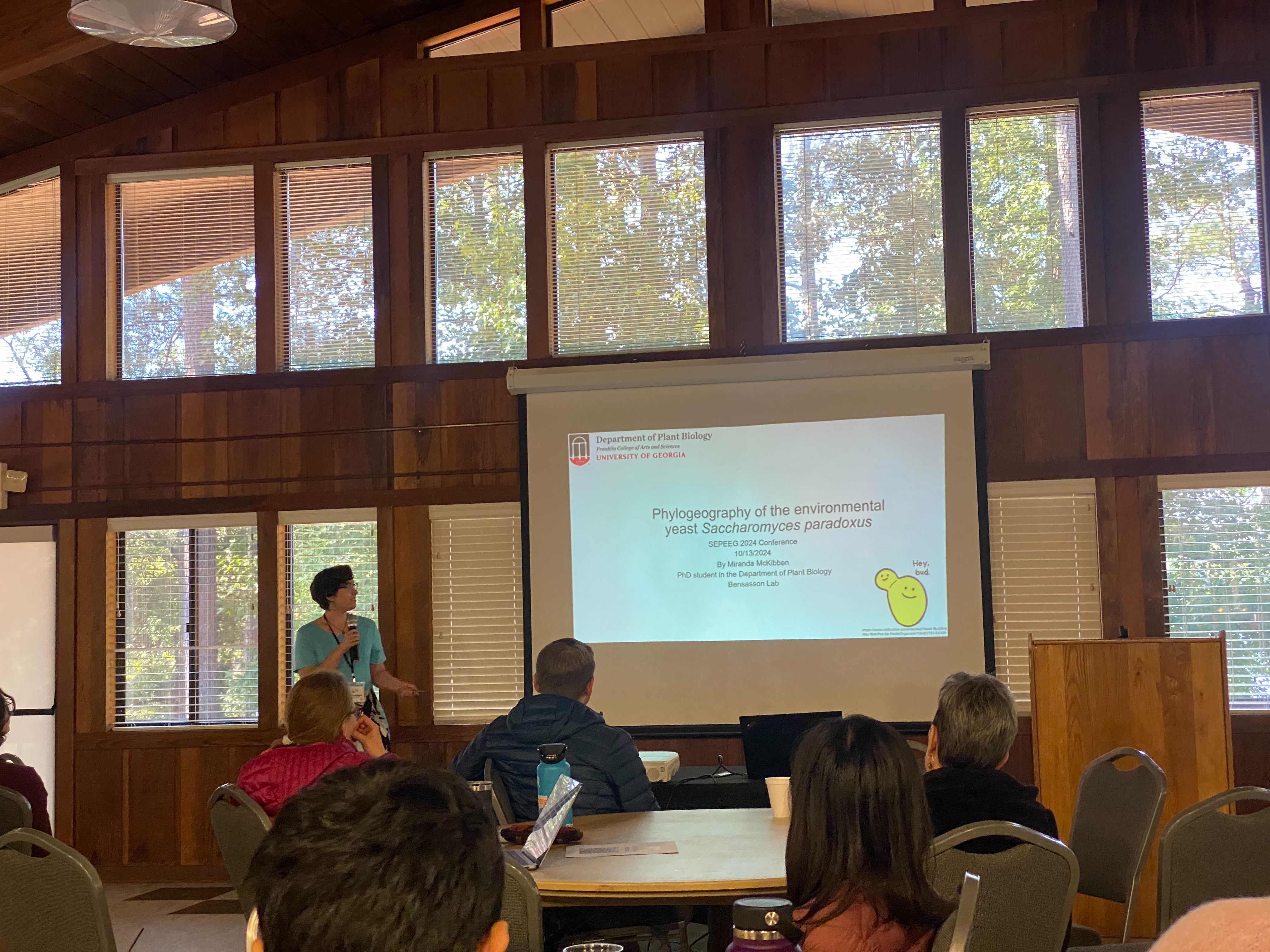 This image shows Miranda McKibben presenting at the 2024 SEPEEG conference